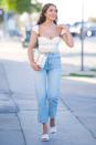 <p>Olivia Culpo smiles as she steps out for drinks in L.A. looking ready for warmer weather on Thursday. </p>