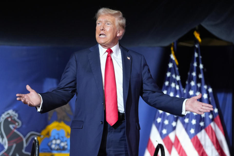 FILE - Republican presidential candidate former President Donald Trump gestures to the crowd as he arrives to speak at a campaign rally, July 31, 2024, in Harrisburg, Pa. Facing the need to win Pennsylvania, Vice President Kamala Harris has sworn off any prior assertion that she opposed fracking. But that hasn't stopped Trump from wielding her now-abandoned position as to win over working-class voters in the key battleground state where the industry means jobs. (AP Photo/Alex Brandon, File)