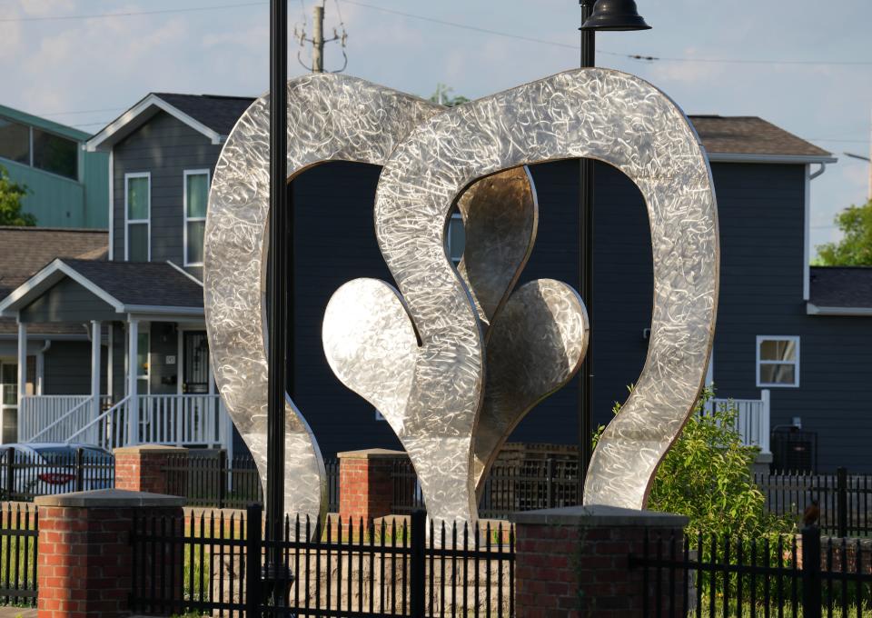 The Boxing Gloves sculpture, created by Ed Hamilton and Zephra May-Miller in 1991, resides in the Smoketown neighborhood of Louisville. The sculpture, also known at the Smoketown Monument, was erected to honor the legacy of Louisville's famous boxers, Muhammad Ali and Jimmy Ellis, and the city's future children.