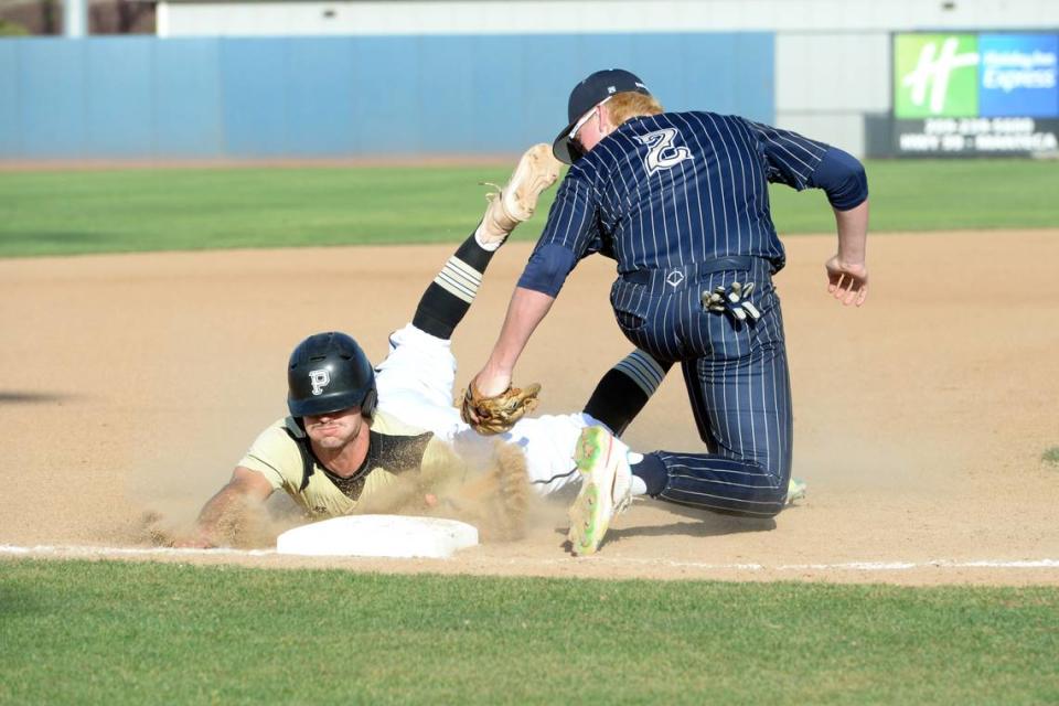 Central Catholic third baseman Seth Van Dyk tags out Pioneer runner Carson Timothy in the first inning of the Sac-Joaquin Section Division III Championship game at Islander’s Park in Lathrop on Thursday, May 25, 2023. Central Catholic won the game 3-2 in extra innings.