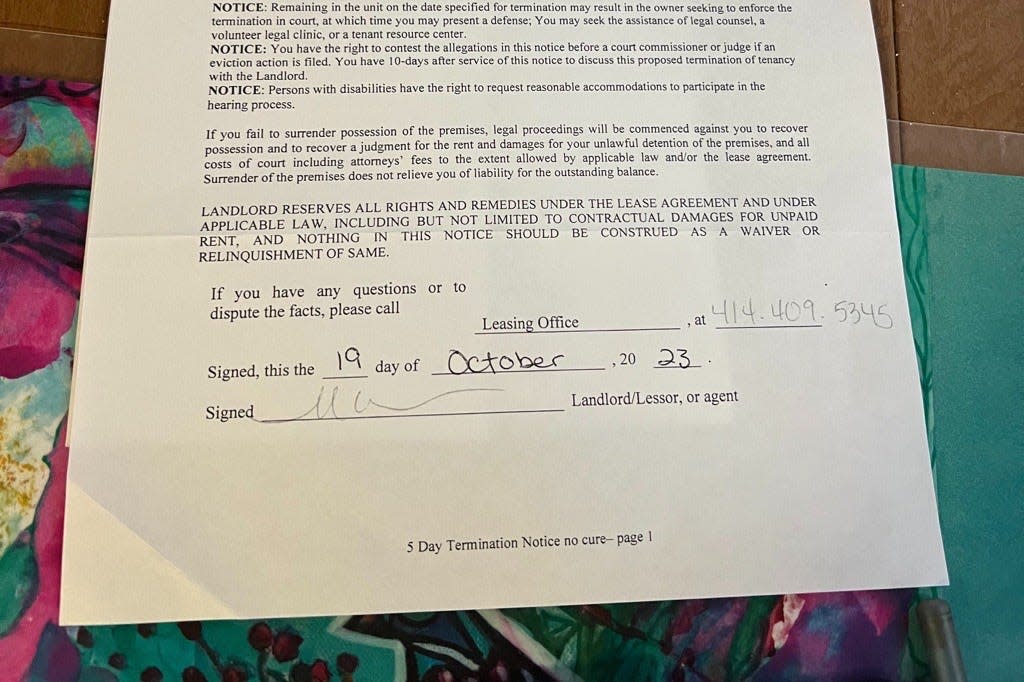 A five-day no cure eviction notice sits on a dining room table.