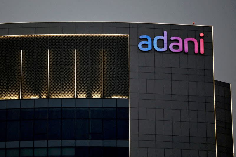 FILE PHOTO: The logo of the Adani group is seen on the facade of one of its buildings on the outskirts of Ahmedabad