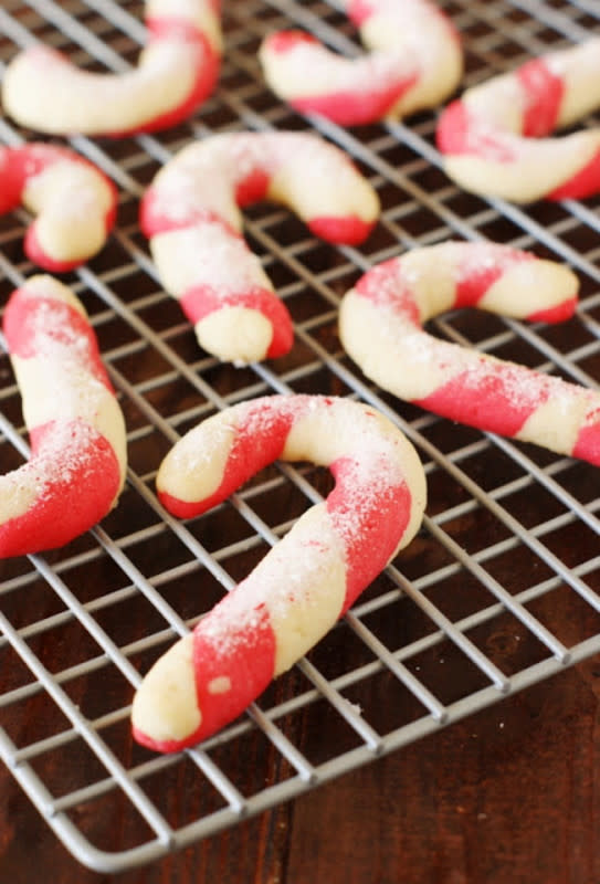 <p>The Kitchen Is My Playground</p><p>Two colors of almond sugar cookie dough twisted together, sprinkled with crushed candy canes and sugar. </p><p>Get the recipe: <a href="http://www.thekitchenismyplayground.com/2012/11/candy-cane-cookies-our-black-friday.html" rel="nofollow noopener" target="_blank" data-ylk="slk:Candy Cane Cookies;elm:context_link;itc:0;sec:content-canvas" class="link rapid-noclick-resp"><strong>Candy Cane Cookies</strong></a></p>