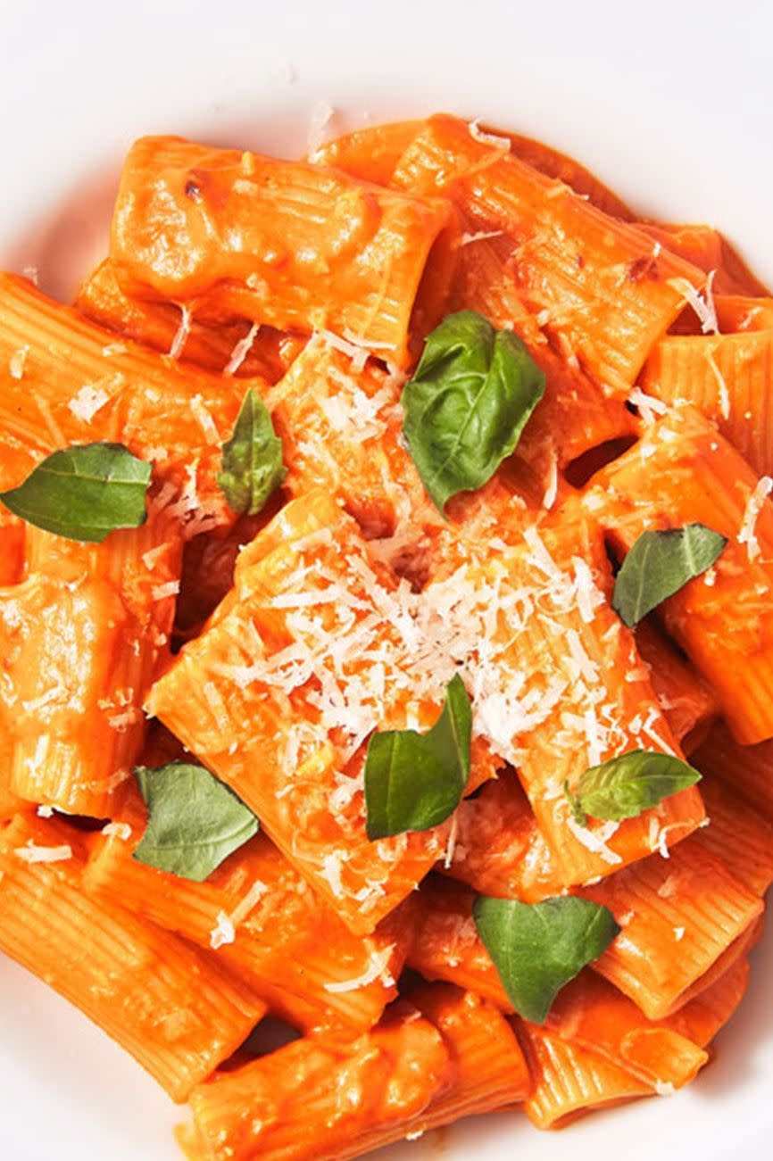 <p>To make sure that each piece of pasta is coated, we like to stir the pasta directly into the sauce while it's still in the pan before adding the last bit of Parmesan. </p><p>Get the <a href="https://www.delish.com/uk/cooking/recipes/a30439232/penne-alla-vodka-recipe/" rel="nofollow noopener" target="_blank" data-ylk="slk:Penne Alla Vodka;elm:context_link;itc:0;sec:content-canvas" class="link ">Penne Alla Vodka</a> recipe.</p>