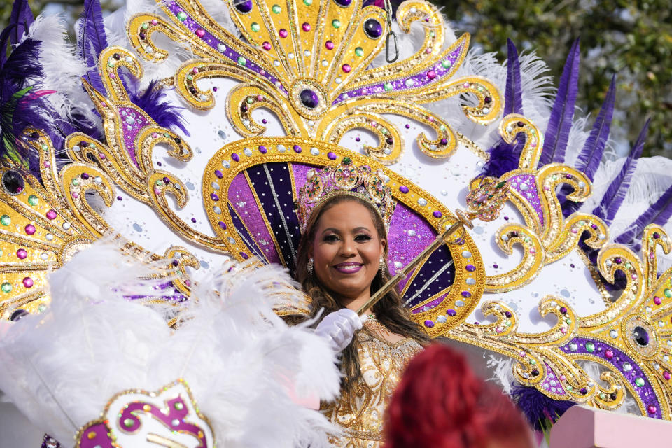 Queen of Zulu Dr. Christy Lagarde Spears rides on a float during the traditional Krewe of Zulu Parade on Mardi Gras Day in New Orleans, Tuesday, Feb. 21, 2023. (AP Photo/Gerald Herbert)