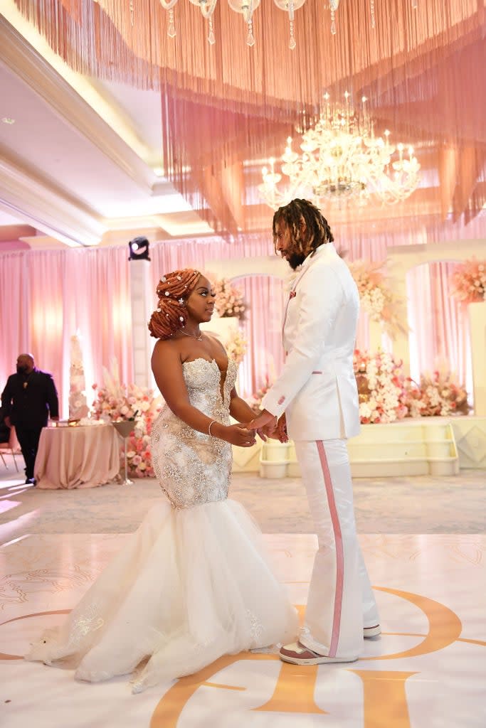 Pinky Cole and Derrick Hayes dance during their wedding at St. Regis Atlanta on June 10, 2023, in Atlanta. (Photo by Paras Griffin/Getty Images)