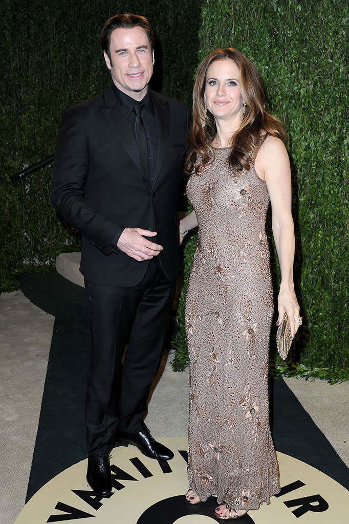 John Travolta and Kelly Preston arrive at the 2013 Vanity Fair Oscar Party hosted by Graydon Carter at Sunset Tower on February 24, 2013 in West Hollywood, California.