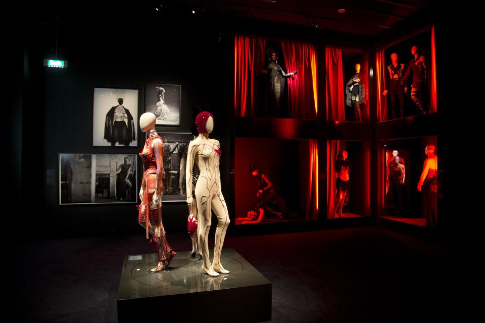 Mannequins inspired by the red light district are seen in the exhibit of French fashion designer Jean Paul Gaultier called "The Fashion World of Jean Paul Gaultier, from the sidewalk to the catwalk", at Kunsthal museum in Rotterdam, Netherlands, Friday Feb. 8, 2013. The exhibit opens to the public on Feb. 10, 2013. (AP Photo/Peter Dejong)