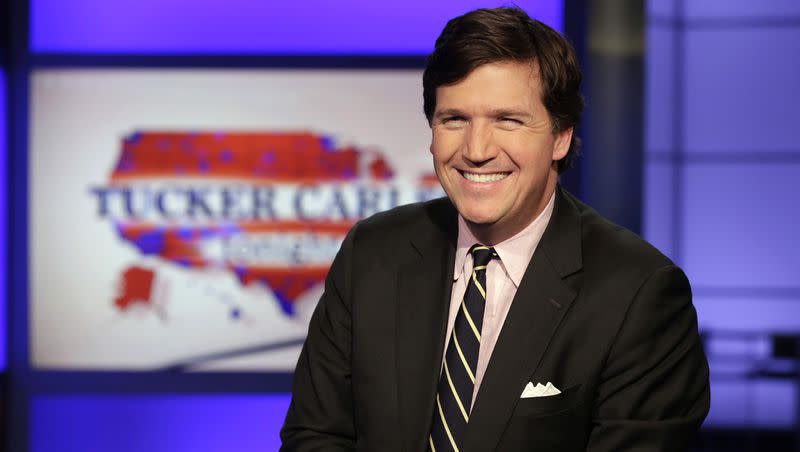 Tucker Carlson poses for photos in a Fox News Channel studio in New York in 2017.