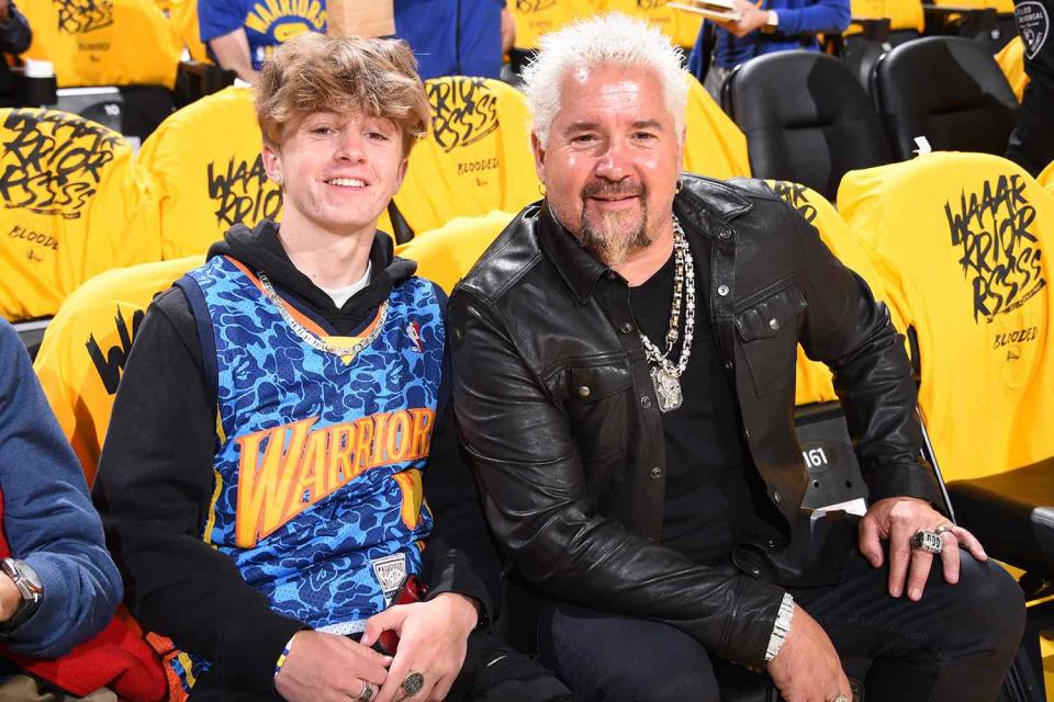 Celebrity Chief, Guy Fieri and his son attend Game 1 of the 2022 NBA Playoffs Western Conference Finals on May 18, 2022 at Chase Center in San Francisco, California