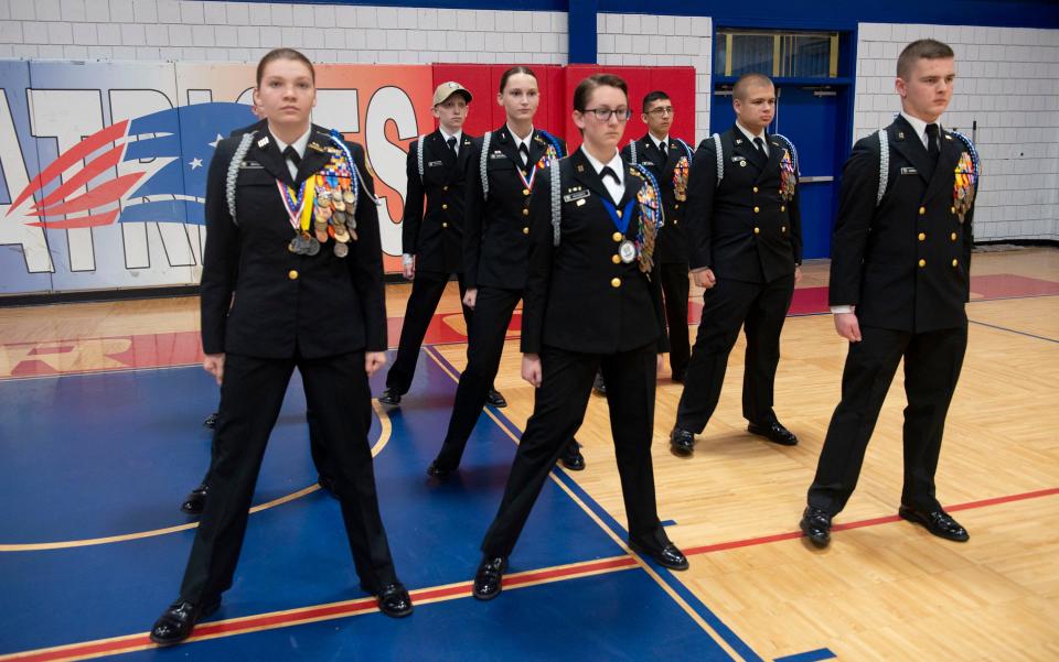 Senior class members of the Pace High School Naval Junior Reserve Officer Training Corps practice their formation drill skills on Wednesday. The team recently won the National Academic, Athletic and Drill Championship.