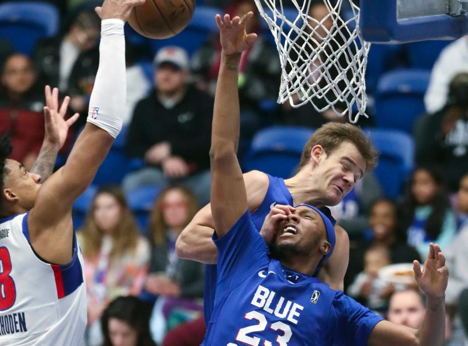 NBA slam dunk contest winner Mac McClung, top right, accidentally tangles with teammate Louis King in McClung's return to the Blue Coats in a G League game at the Chase Fieldhouse on Wednesday, Feb. 22, 2023.