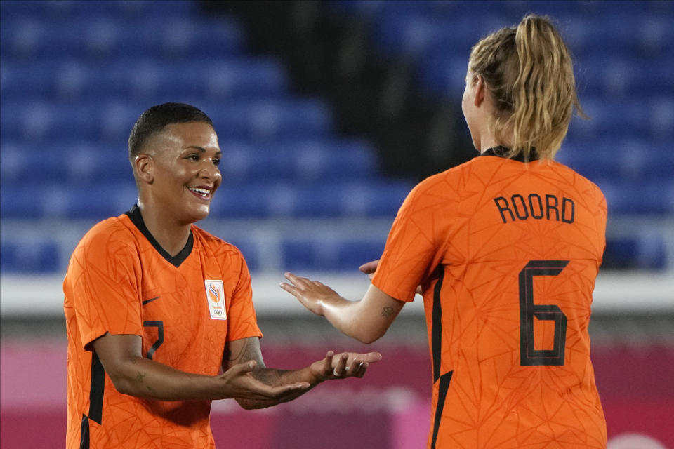 Netherlands' Shanice van de Sanden, left, celebrates with Jill Roord after scoring a goal during a women's soccer match against China at the 2020 Summer Olympics, Tuesday, July 27, 2021, in Yokohama, Japan. (AP Photo/Kiichiro Sato)