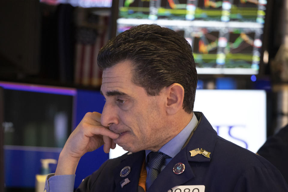 Trader Peter Mazza works at the New York Stock Exchange, Tuesday, Dec. 3, 2019. Stocks fell broadly Tuesday after President Donald Trump cast doubt over the potential for a trade deal with China this year and threatened to impose tariffs on French goods. (AP Photo/Mark Lennihan)