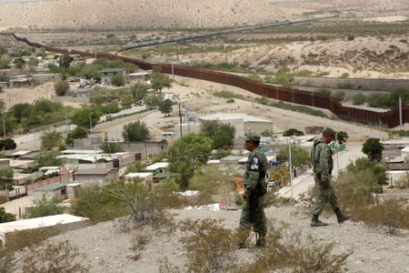 Members of the Mexican National Guard patrol the border with the United states, as seen from Anapra neighborhood, on the outskirts of Ciudad Juarez