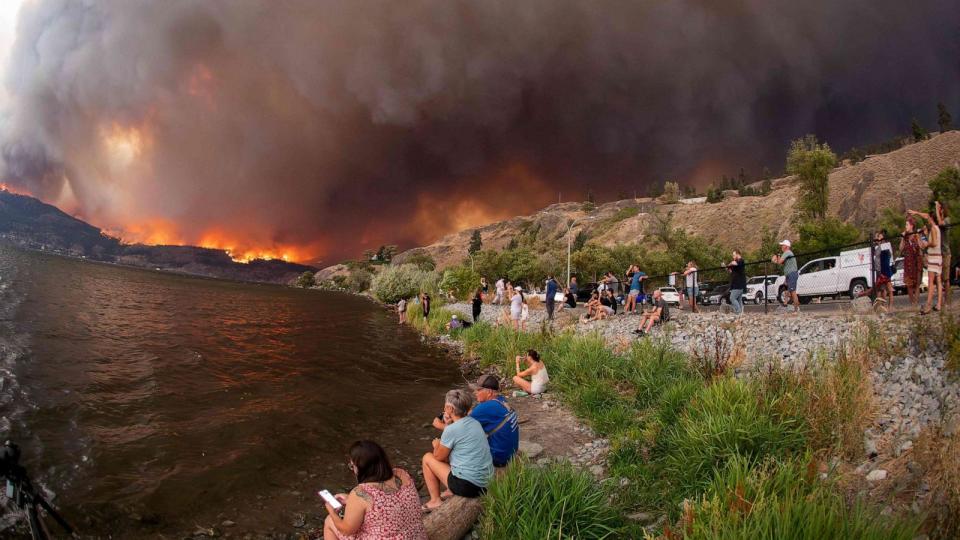 PHOTO: Residents watch the McDougall Creek wildfire in West Kelowna, British Columbia, Canada, on Aug. 17, 2023. (Darren Hull/AFP via Getty Images)