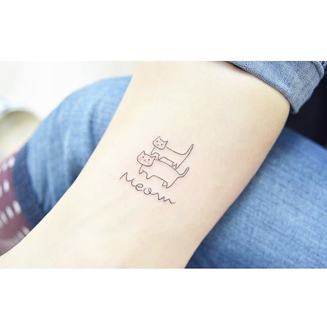 11) Minimalist Cat Tattoo