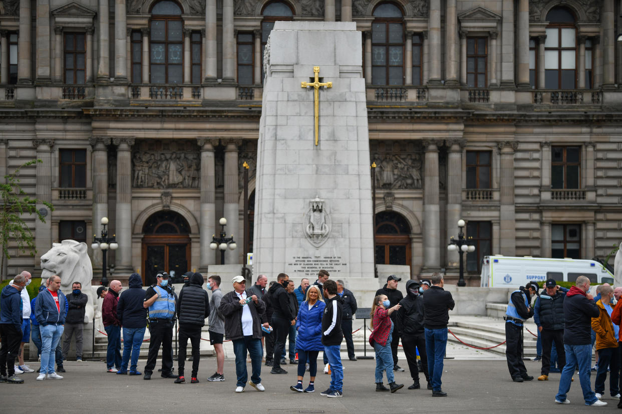 GLASGOW, SCOTLAND - JUNE 13: Activists gather at the cenotaph in George Square to protect it from any vandalism attacks on June 13, 2020 in Glasgow, Scotland. The Loyalist Defence League has asked followers to gather in George Square today for a 'protect the Cenotaph' event in response to statues being defaced across Scotland following BLM demonstrations. (Photo by Jeff J Mitchell/Getty Images)