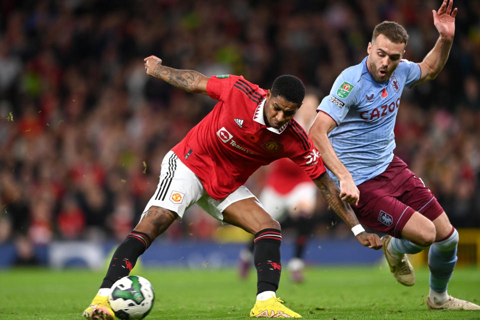 MANCHESTER, ENGLAND - NOVEMBER 10: Manchester United player Marcus Rashford shoots to score the second United goal during the Carabao Cup Third Round match between Manchester United and Aston Villa at Old Trafford on November 10, 2022 in Manchester, England. (Photo by Stu Forster/Getty Images)