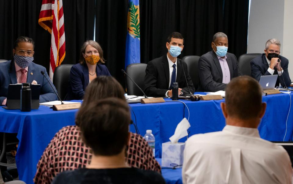 The Oklahoma Pardon and Parole Board listens to the presentation from murder victim Paul Howell's family during the Julius Jones commutation hearing before the Oklahoma Pardon and Parole Board at the Kate Barnard Community Corrections Center in Oklahoma City, Okla. on Monday, Sept. 13, 2021. The Oklahoma Pardon and Parole Board voted 3-1 in recommending commutation of Julius Jones' death sentence.