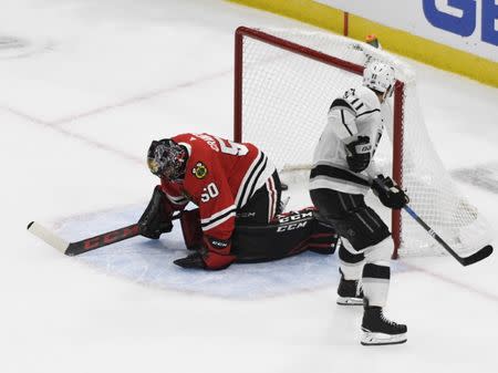 Nov 16, 2018; Chicago, IL, USA; Los Angeles Kings center Anze Kopitar (11) scores a goal on Chicago Blackhawks goaltender Corey Crawford (50) in a shootout at United Center. David Banks-USA TODAY Sports