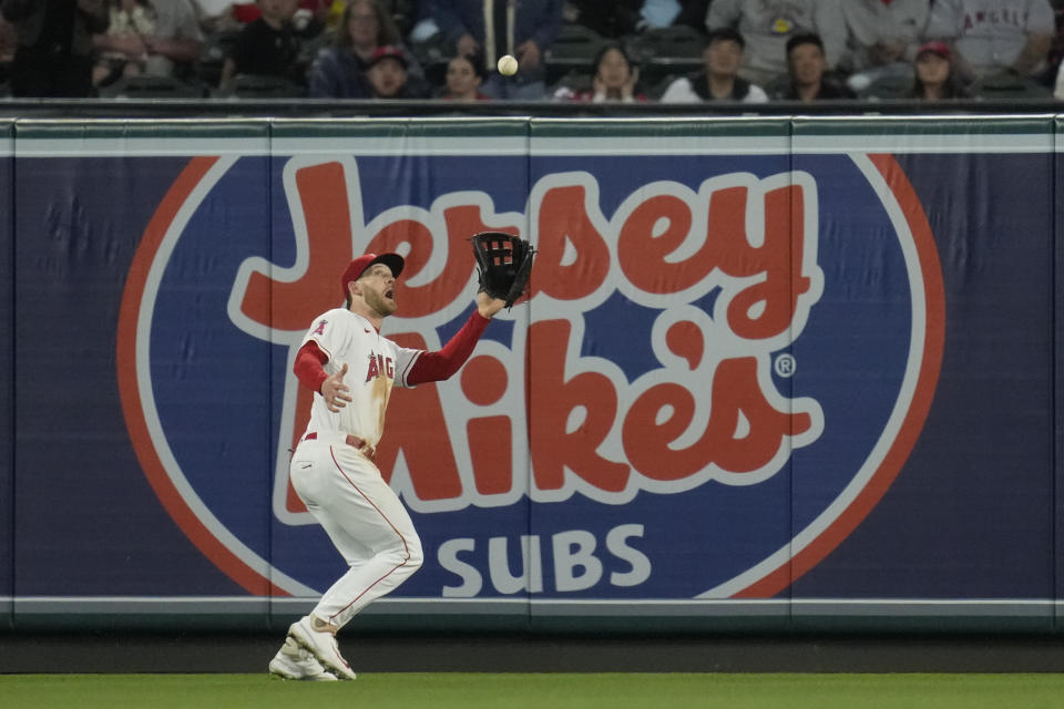 Los Angeles Angels left fielder Taylor Ward catches a fly ball hit by Houston Astros designated hitter Alex Bregman during the fifth inning of a baseball game in Anaheim, Calif., Monday, May 8, 2023. (AP Photo/Ashley Landis)