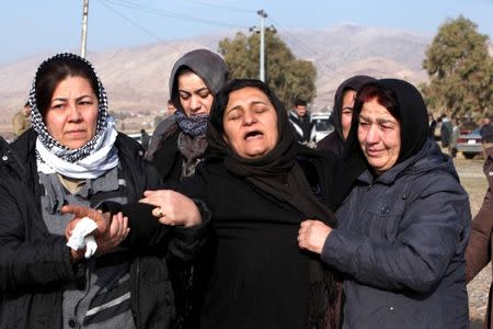 Mourners react during a funeral of victims who were killed in a bomb attack at the offices of the Democratic Party of Iranian Kurdistan (PDKI) in Koy Sanjak, east of Erbil, Iraq, December 21, 2016. REUTERS/Azad Lashkari