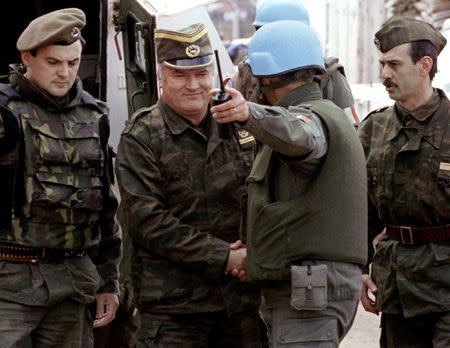 FILE PHOTO: Bosnian Serb wartime general Ratko Mladic (2ndL) and a French Foreign Legion officer on his arrival at a failed UN-sponsored meeting in Sarajevo, Bosnia and Herzegovina, April 12, 1993. REUTERS/Stringer/File Photo