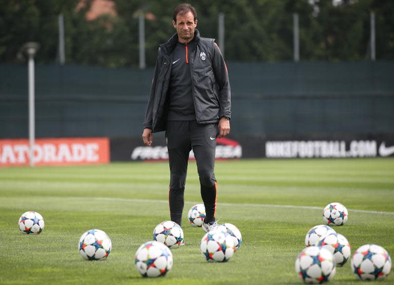 Juventus' coach Massimiliano Allegri takes part in a training session on the eve of the UEFA Champions League semifinal football match Juventus Vs Real Madrid on May 4, 2015