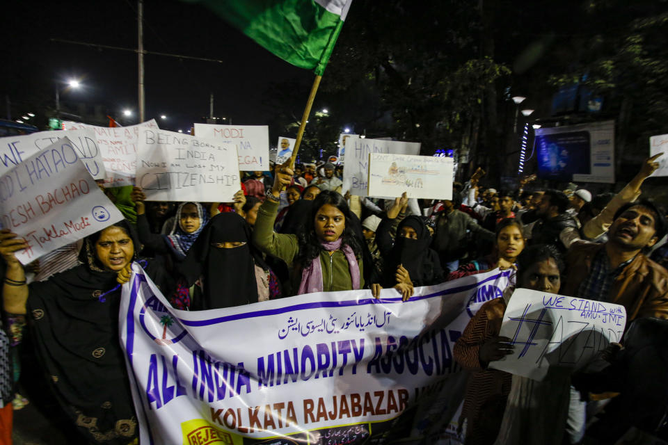 Indians shout slogans during a protest against the Citizenship Amendment Act after Friday prayers outside a mosque in Kolkata, India, Friday, Dec. 20, 2019. Police banned public gatherings in parts of the Indian capital and other cities for a third day Friday and cut internet services to try to stop growing protests against a new citizenship law that have left more than 10 people dead and more than 4,000 others detained. (AP Photo/Bikas Das)