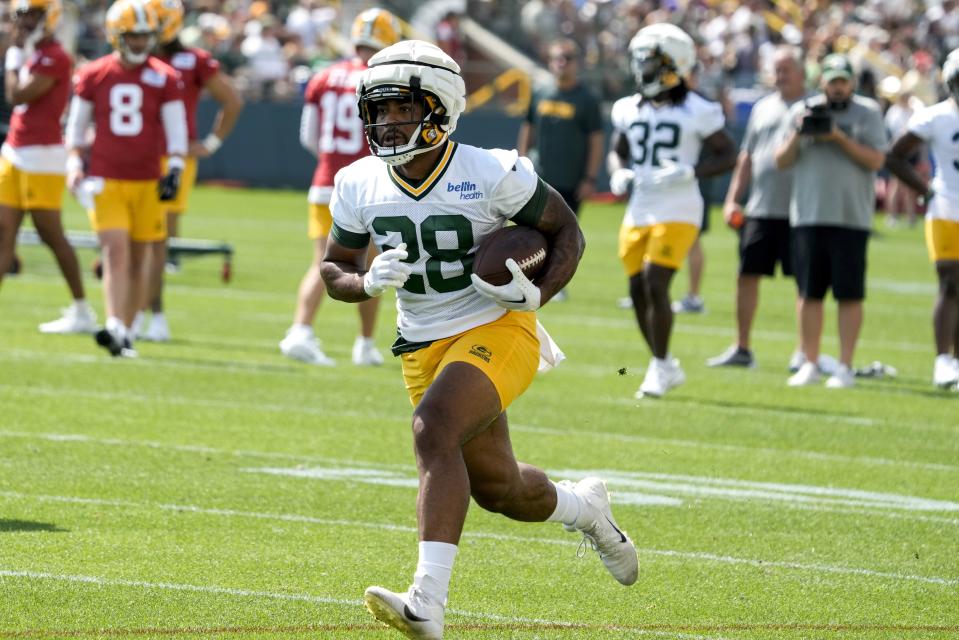 Green Bay Packers' AJ Dillon runs during NFL football training camp Thursday, July 27, 2023, in Green Bay, Wis. (AP Photo/Morry Gash)