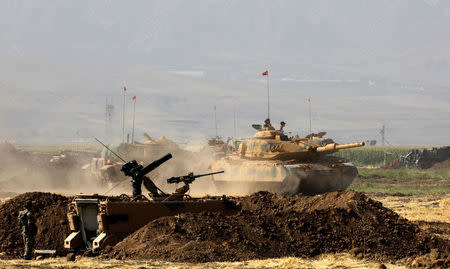 A Turkish tank maneuvers during a military exercise near the Turkish-Iraqi border in Silopi, Turkey, September 22, 2017. REUTERS/Umit Bektas