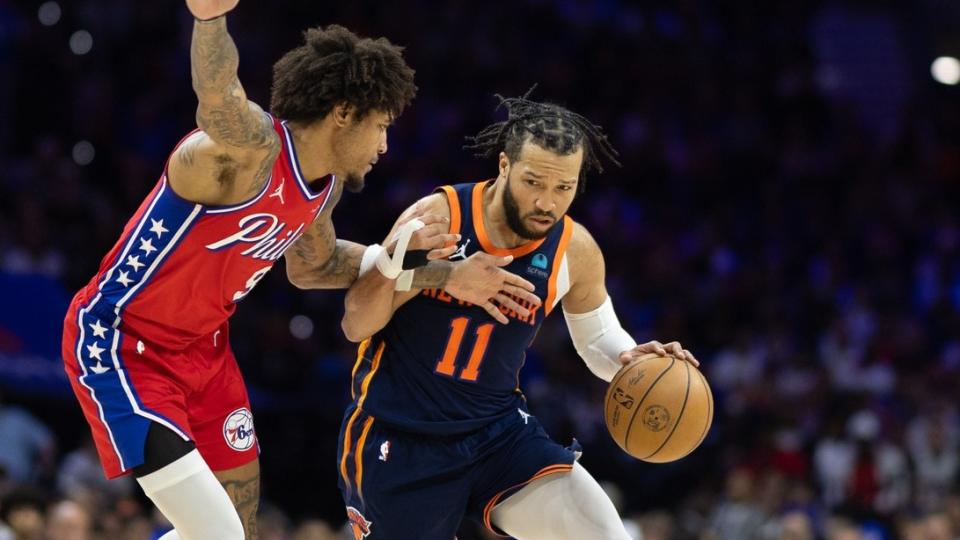 April 28, 2024;  Philadelphia, Pennsylvania, USA;  New York Knicks guard Jalen Brunson (11) drives into Philadelphia 76ers guard Kelly Oubre Jr.  (9) during the second half of game four of the first round in the 2024 NBA playoffs at Wells Fargo Center.