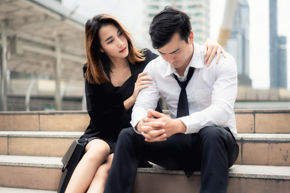 a couple sitting outside together