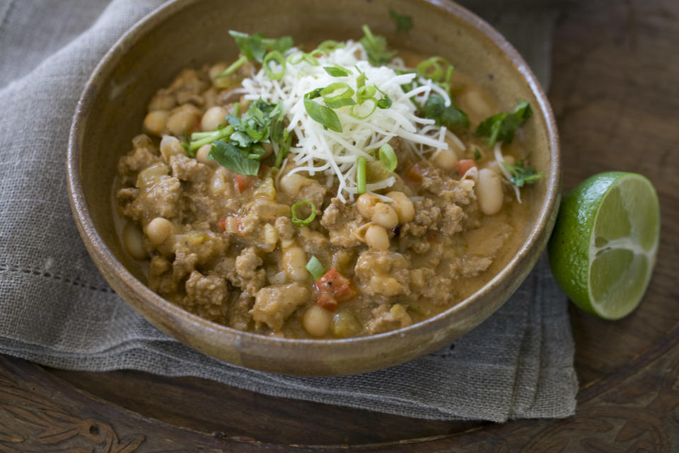 This Sept. 9, 2013 photo shows white chicken chili with lime in Concord, N.H. White beans are a good source of fiber - which means this chili will fill you up - and a very good source of folate and manganese. (AP Photo/Matthew Mead)