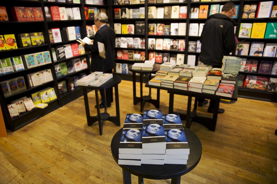 Copies of the Morrissey "Autobiography" lie stacked up on display at a branch of a bookstore in north London, Friday, Oct. 18, 2013. The memoir from the former frontman of The Smiths _ titled simply "Autobiography" _ is the first rock bio published under the venerable Penguin Classics imprint, home to Aeschylus, Jane Austen and Oscar Wilde. That has horrified some people in the publishing industry, but not the singer's many fans, who snapped up the book as soon as it was published Thursday. (AP Photo/Matt Dunham)