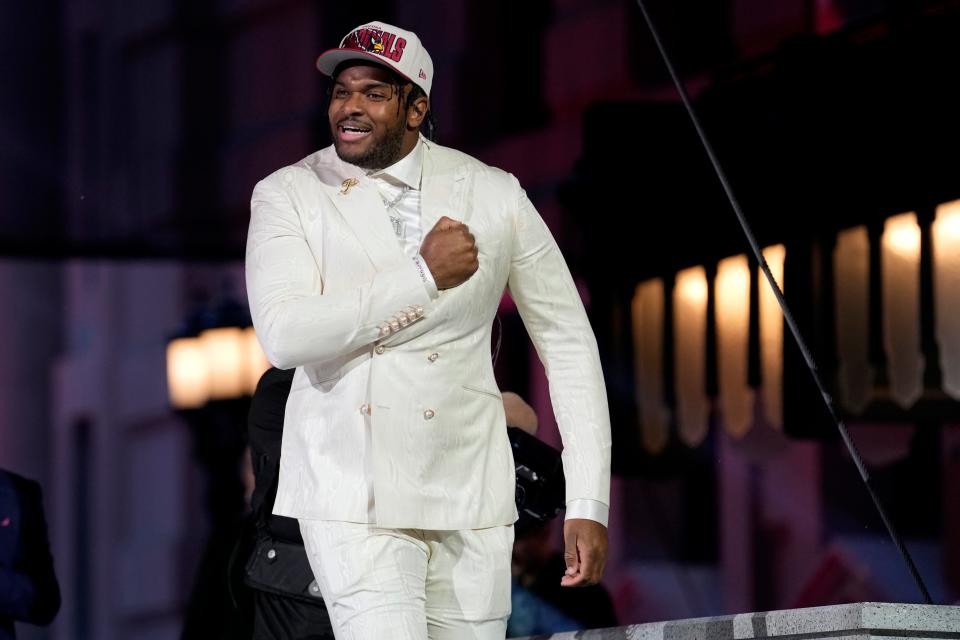 Ohio State offensive tackle Paris Johnson Jr. walks onto the stage after Johnson was chosen by the Arizona Cardinals with the No. 6 pick at the 2023 NFL Draft, Thursday, April 27, 2023, in Kansas City, Mo. (AP Photo/Steve Luciano)