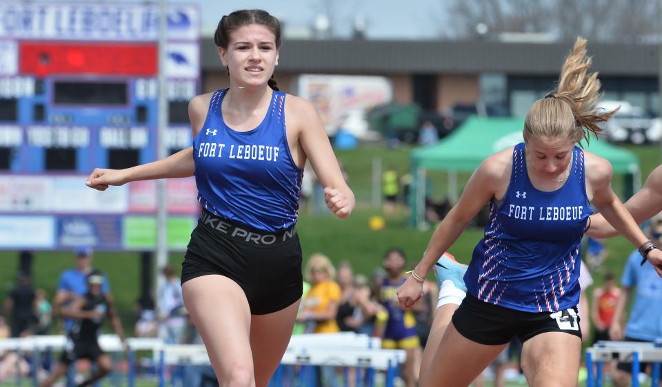 Fort LeBoeuf High School's Alena Urbanowicz, left, wins the girls 100-meter dash final during the Fort LeBoeuf Invitational track and field meet in Waterford on Saturday.