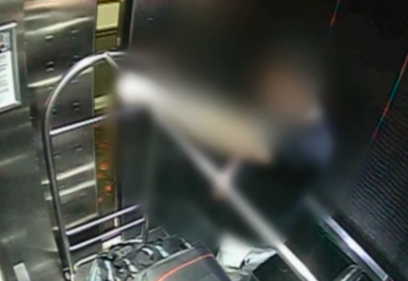 CCTV footage of blurred image of murder accused in a hotel lift with a suitcase which Grace Millane's body was inside.