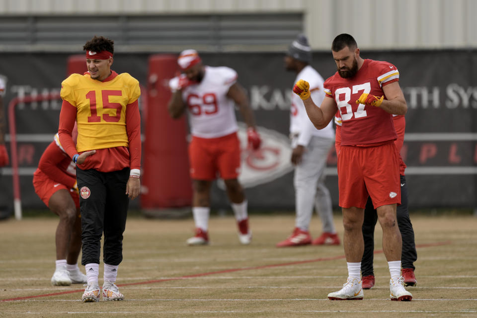 Kansas City Chiefs quarterback Patrick Mahomes (15) and tight end Travis Kelce (87) stretch during the team's NFL football practice Thursday, Feb. 1, 2024 in Kansas City, Mo. The Chiefs will play the San Francisco 49ers in Super Bowl 58. (AP Photo/Charlie Riedel)