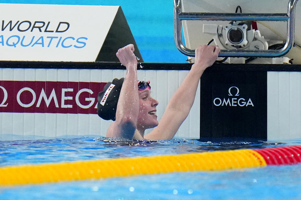 Claire Curzan of the United States celebrates after winning the women's 200 meters backstroke final at the World Aquatics Championships in Doha, Qatar, Saturday, Feb. 17, 2024. (AP Photo/Hassan Ammar)