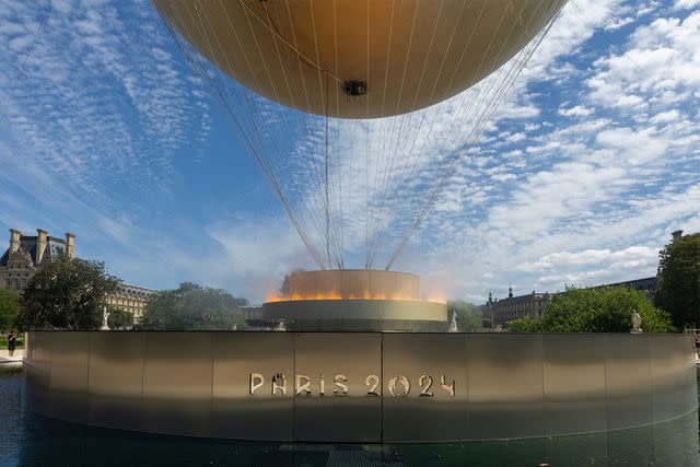 <p>ANDRE PAIN/EPA-EFE/Shutterstock</p> The Olympic cauldron during the day