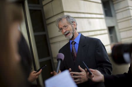 Douglas Hughes talks to reporters outside of a courthouse in Washington June 22, 2015. REUTERS/Carlos Barria