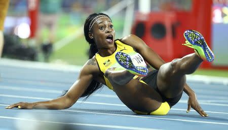 2016 Rio Olympics - Athletics - Final - Women's 200m Final - Olympic Stadium - Rio de Janeiro, Brazil - 17/08/2016. Elaine Thompson (JAM) of Jamaica reacts after winning the gold. REUTERS/Lucy Nicholson