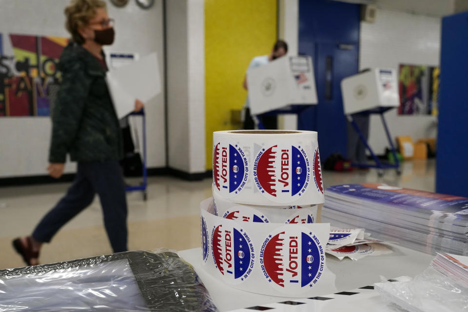 Voters mark their ballots at Frank McCourt High School, in New York, Tuesday, June 22, 2021. The final votes are set to be cast Tuesday in New York's party primaries, where mayors, prosecutors, judges and city and county legislators will be on the ballot, along with other municipal offices. (AP Photo/Richard Drew)