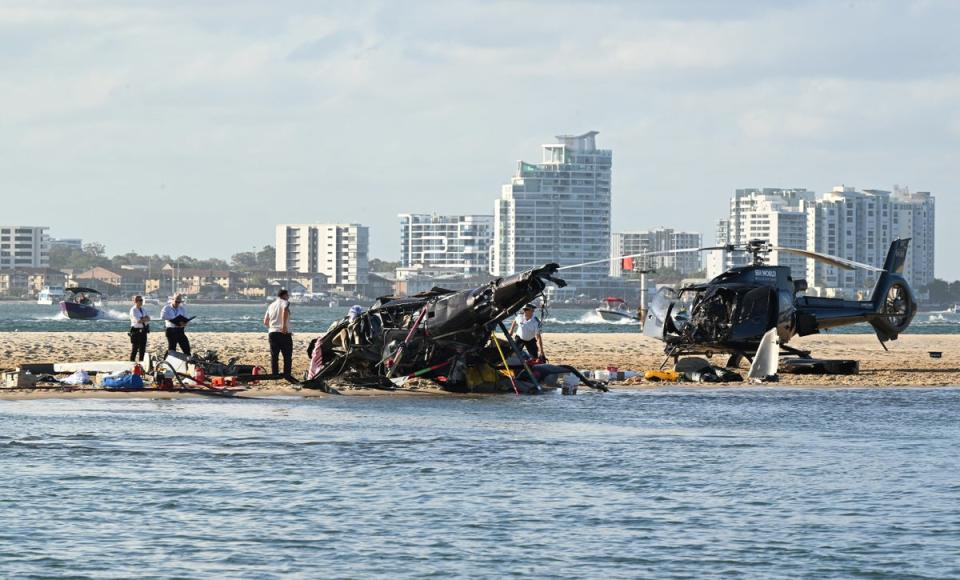 The wreckage of two helicopters are seen following a collision near Seaworld, on the Gold Coast (REUTERS)