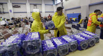 <p>Officials deliver water to an holding area for residents waiting to be evacuated, Friday, Aug. 25, 2017, in Corpus Christi, Texas. (Photo: Eric Gay/AP) </p>