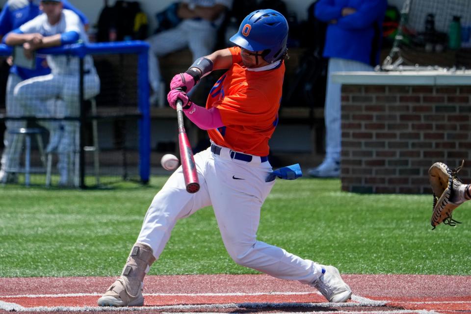 Olentangy Orange's Diego Astacio takes a cut during a Division I regional semifinal against Olentangy Liberty on June 1.