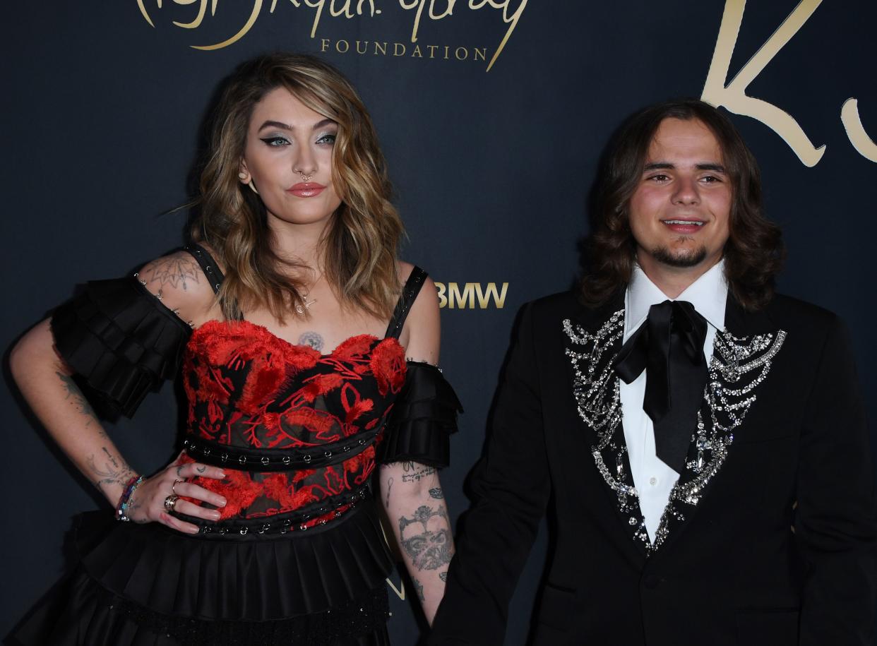 Paris Jackson (L) and her brother Prince Jackson (R) arrive for the Ryan Gordy Foundation 60 Years of Motown Celebration at the Waldorf Astoria in Beverly Hills on November 11, 2019. (Photo by Mark RALSTON / AFP) (Photo by MARK RALSTON/AFP via Getty Images)