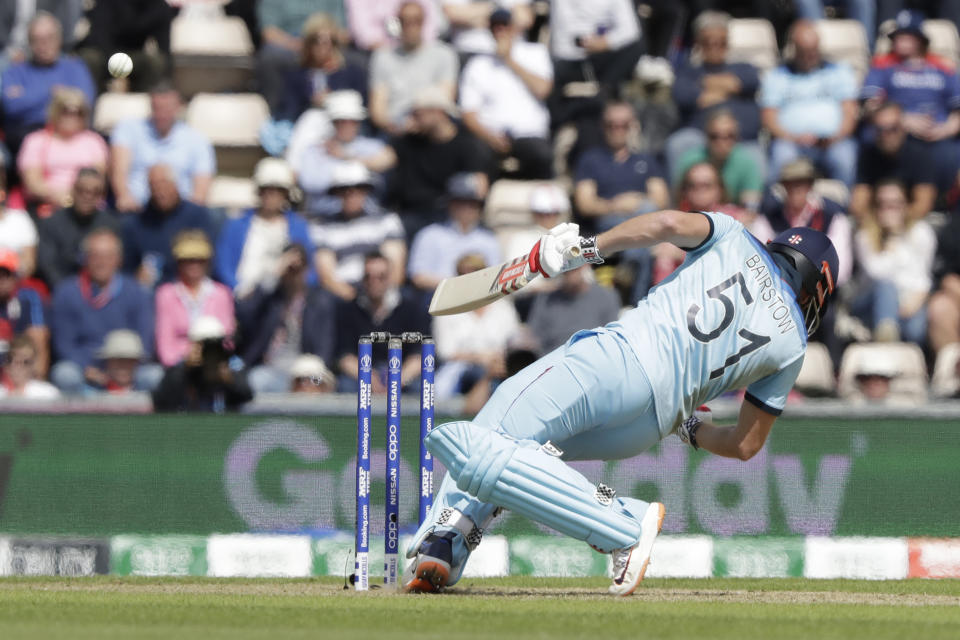 England's Jonny Bairstow ducks a bouncer from West Indies' Andre Russell during the Cricket World Cup match between England and West Indies at the Hampshire Bowl in Southampton, England, Friday, June 14, 2019. (AP Photo/Matt Dunham)